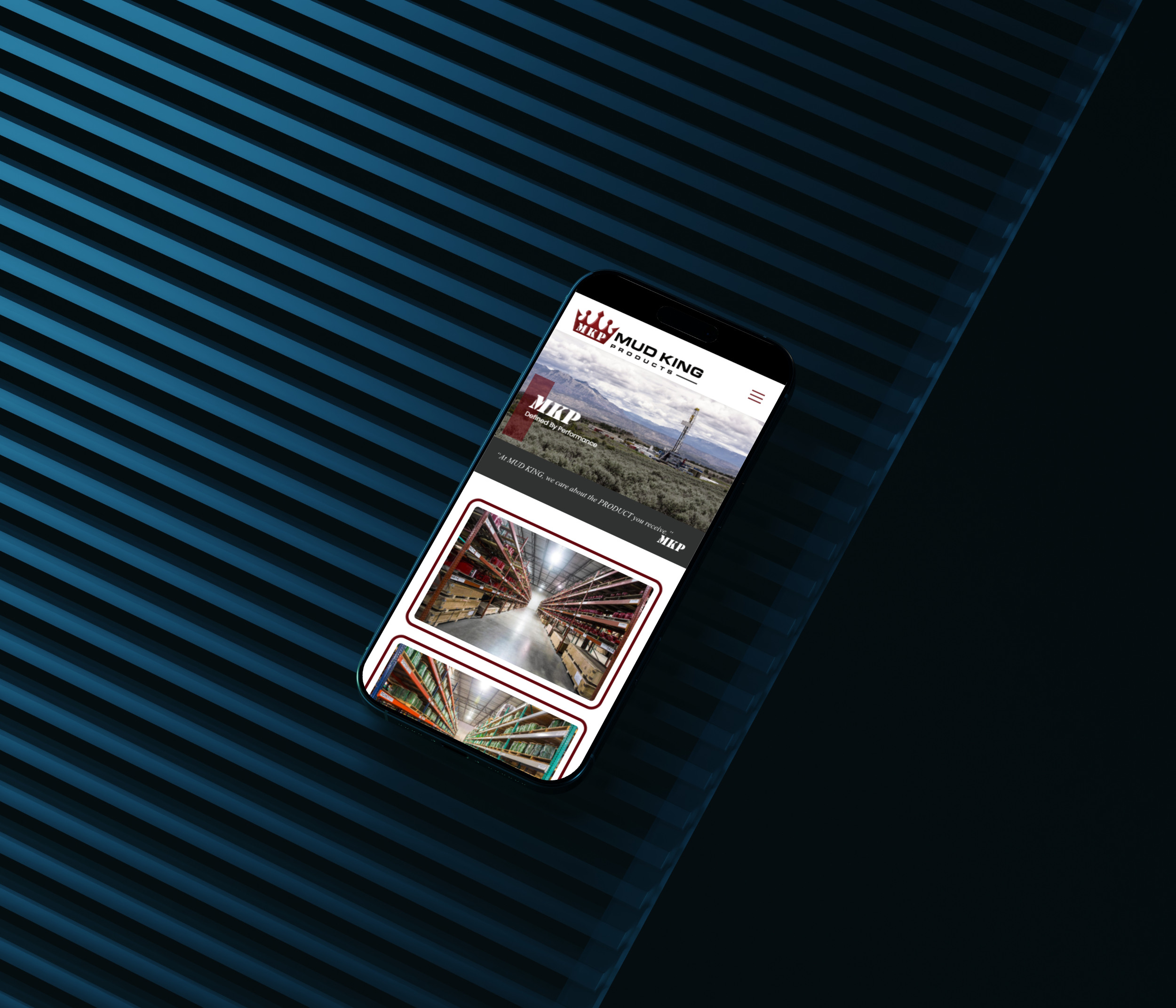Smartphone Displaying the Mud King Products Website on a Diagonally Striped Blue Background