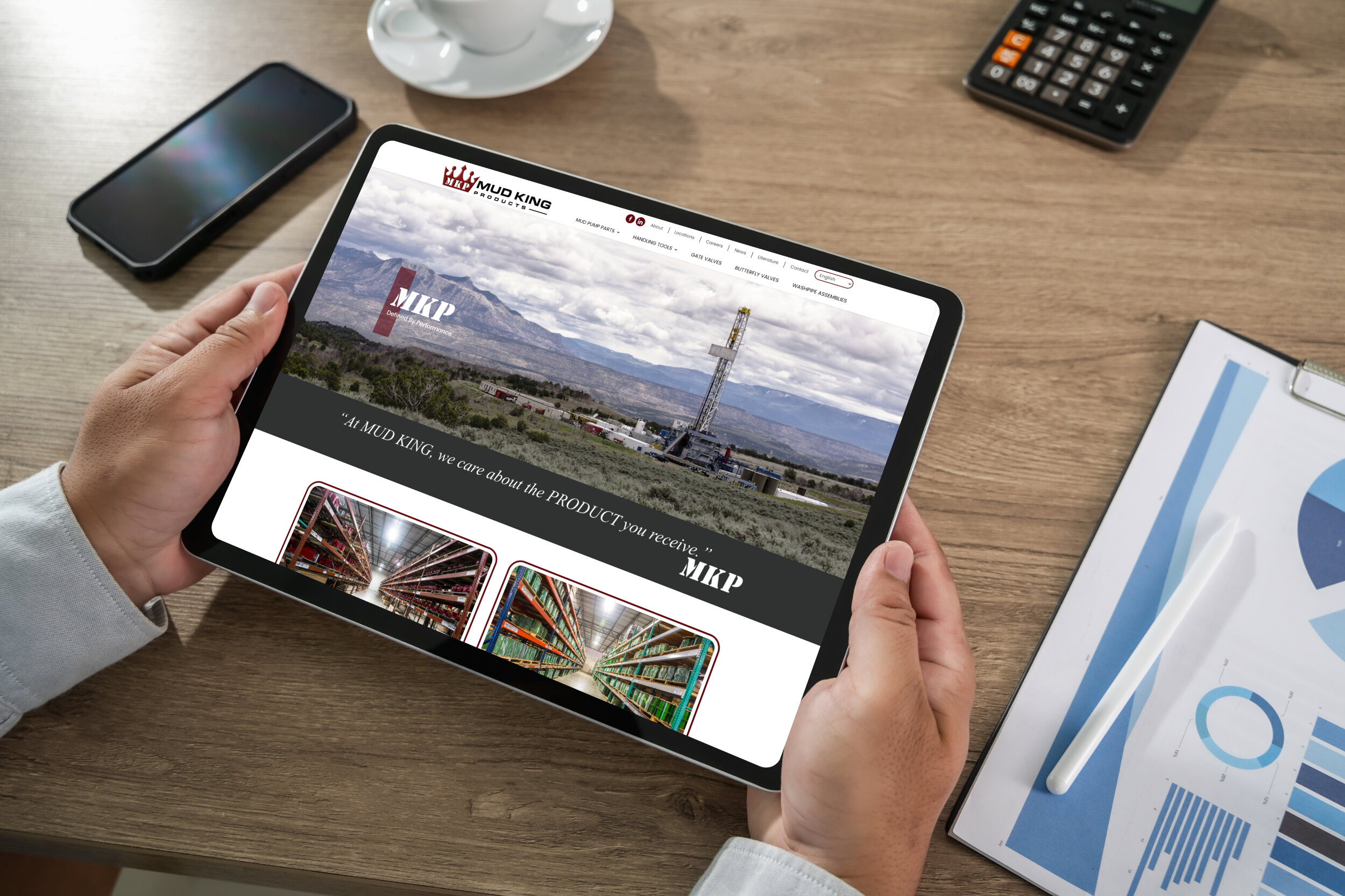 Tablet Screen Showing the Mud King Products Website with a Mountainous Landscape Hero Image and a Product Gallery