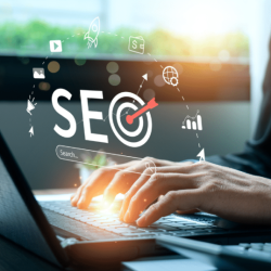 Person working on laptop with SEO analytics icons and digital marketing elements representing SEO in 2026 trends
