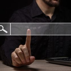 Man using a search box to research website search performance