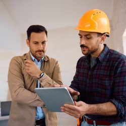 contractor with tablet crm software and customer