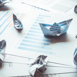 Group of boat made with paper graph in stormy of business.Only one boat can be success.
